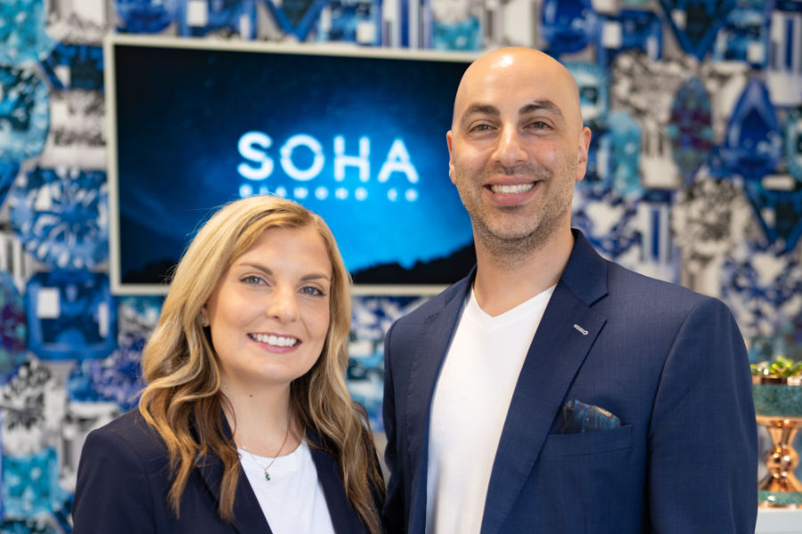 Two owners wearing matching outfits