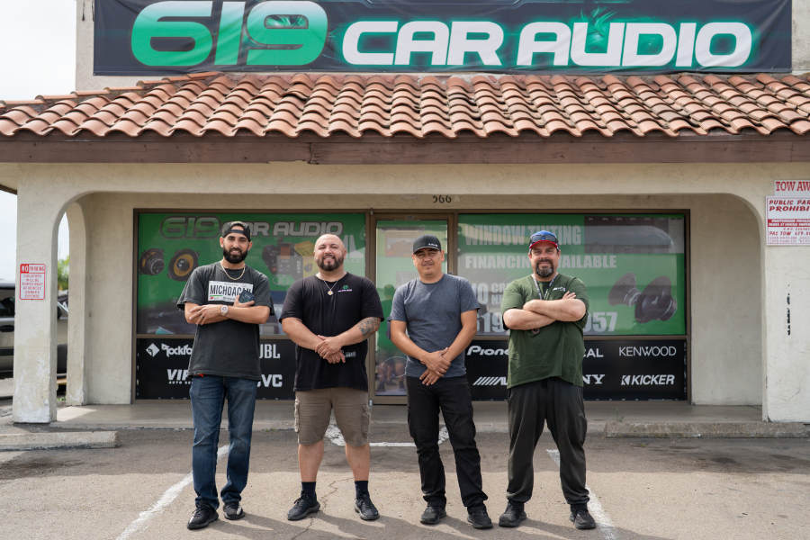 Men in front of an audio shop